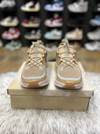On Cloudaway sneakers in a bronze and tan colorway,