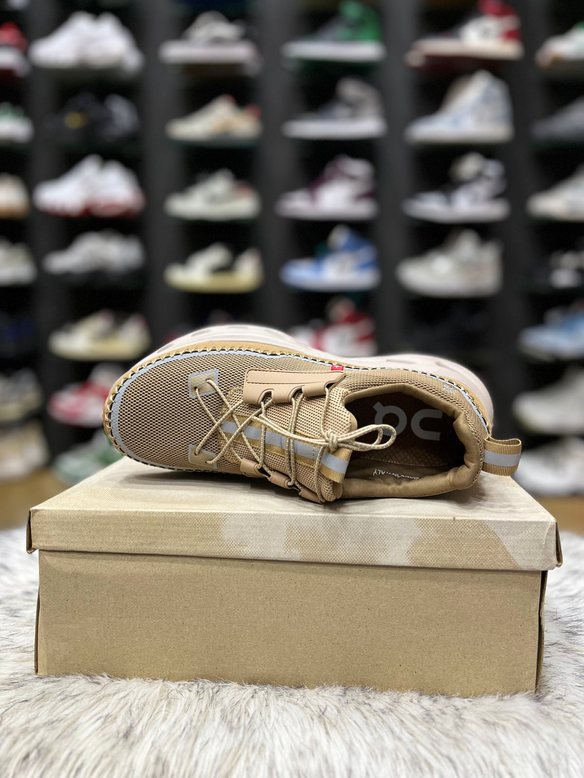 On Cloudaway sneakers in a bronze and tan colorway,